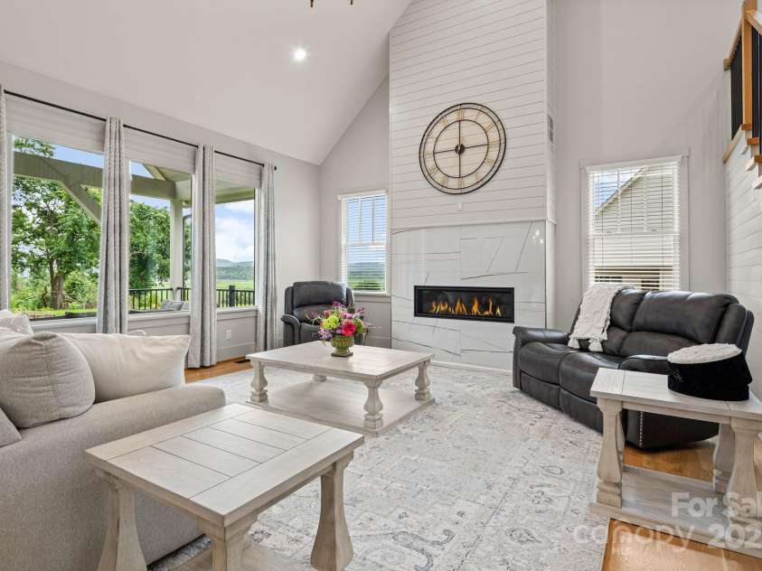 301 Rockbridge Road, Mills River, NC 28759.  MLS# CAR4265913, YatesRealty ID 16585. Living Room looking out to covered back porch