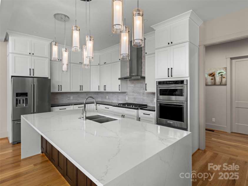 301 Rockbridge Road, Mills River, NC 28759.  MLS# CAR4296357, YatesRealty ID 16585. Lots of workspace with this island.