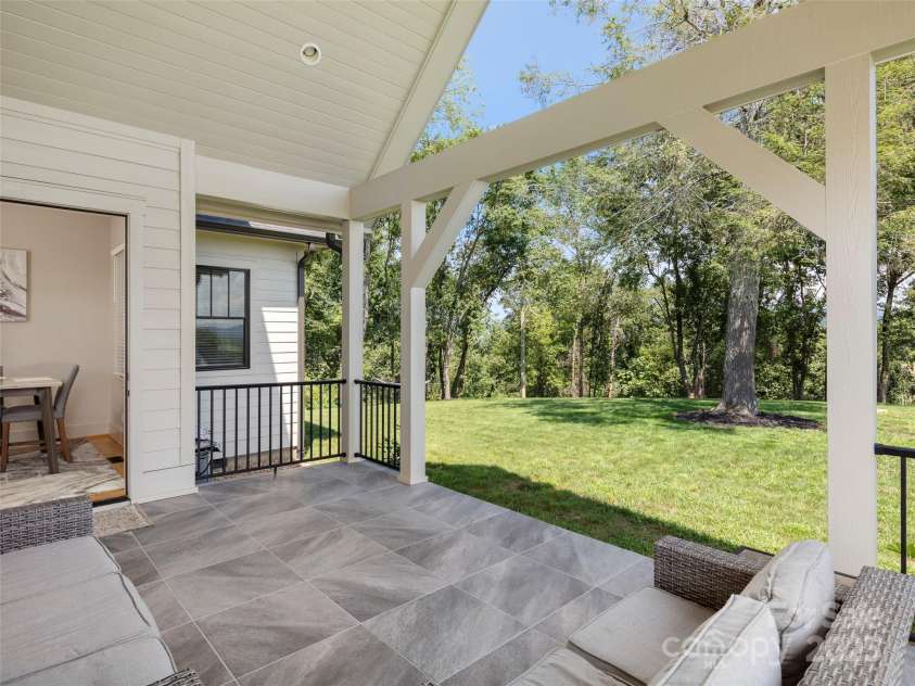 301 Rockbridge Road, Mills River, NC 28759.  MLS# CAR4296357, YatesRealty ID 16585. Slip and frost resistant tile on the patio!