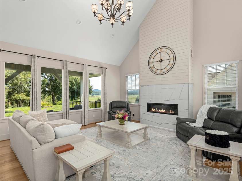 301 Rockbridge Road, Mills River, NC 28759.  MLS# CAR4296357, YatesRealty ID 16585. Stunning neutral great room with gas fireplace.