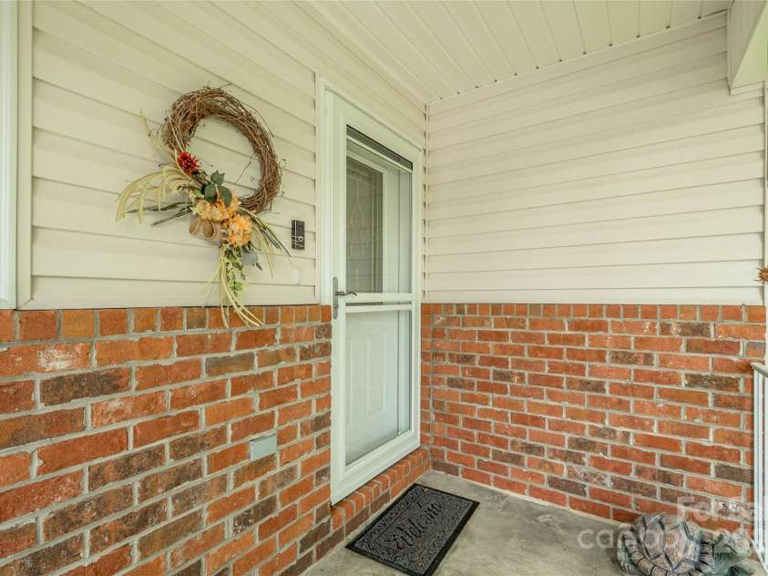 174 Allen Paul Drive, Hendersonville, NC 28791.  MLS# CAR4261580, YatesRealty ID 16587. Front Covered Porch