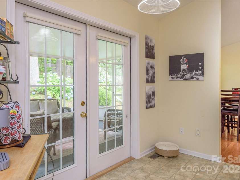 174 Allen Paul Drive, Hendersonville, NC 28791.  MLS# CAR4261580, YatesRealty ID 16587. Kitchen/Entrance to Screened Porch