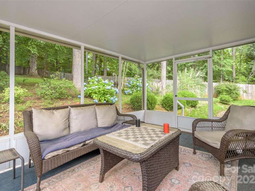 174 Allen Paul Drive, Hendersonville, NC 28791.  MLS# CAR4261580, YatesRealty ID 16587. Screened Back Porch