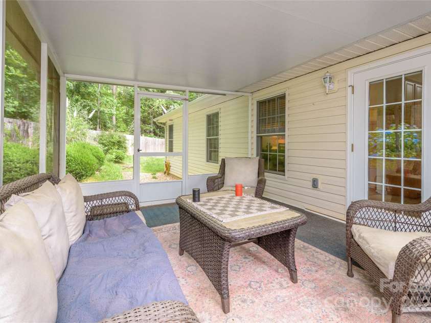 174 Allen Paul Drive, Hendersonville, NC 28791.  MLS# CAR4261580, YatesRealty ID 16587. Screened Back Porch