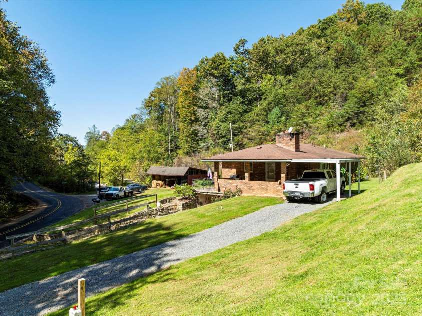 1623 Ammons Branch Road, Marshall, NC 28753.  MLS# CAR4307032, YatesRealty ID 166. Carport on upper driveway