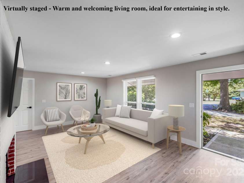 2000 Tyvola Road, Charlotte, NC 28210.  MLS# CAR4260481, YatesRealty ID 16600. Virtually staged - Warm and welcoming living room, ideal for entertaining in style.