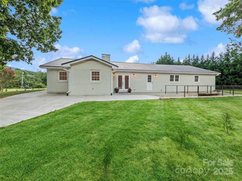 106 Whispering Hills Drive, Hendersonville, NC 28792.  MLS# CAR4251475, YatesRealty ID 16616. Back side ramp and Entrance