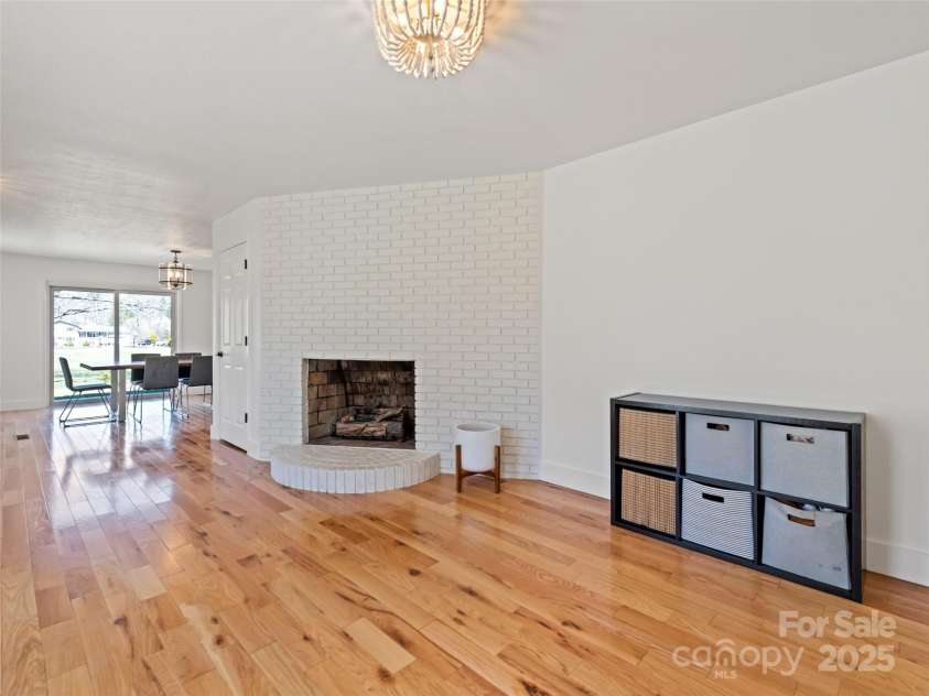 106 Whispering Hills Drive, Hendersonville, NC 28792.  MLS# CAR4251475, YatesRealty ID 16616. Sitting Area with Fireplace close to kitchen