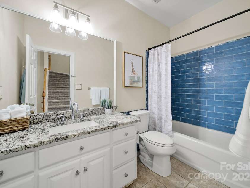 1569 Benjamen Latrobe Circle, Fort Mill, SC 29708.  MLS# CAR4235857, YatesRealty ID 16622. Hall Bath - Granite Vanity, Tile Tub Surround, Tile Floors