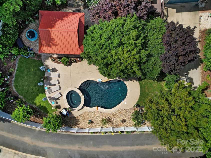 1569 Benjamen Latrobe Circle, Fort Mill, SC 29708.  MLS# CAR4235857, YatesRealty ID 16622. Resort Backyard - Heated Gunite Saltwater Pool & Spa, Tiki Bar, Stone Fireplace, Professional Landscaped, Privacy Fence