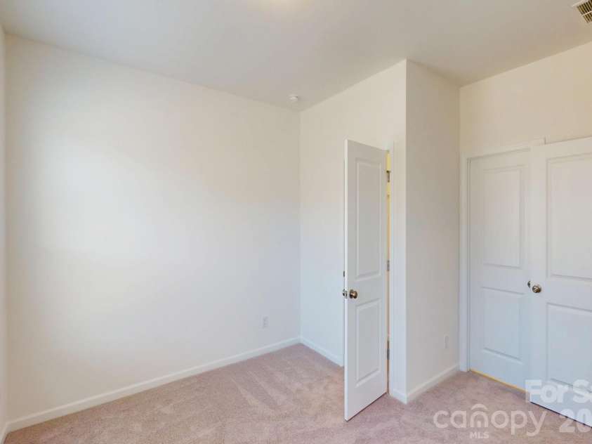 1320 Fremont Drive, Wingate, NC 28174.  MLS# CAR4326662, YatesRealty ID 16623. Secondary bedroom