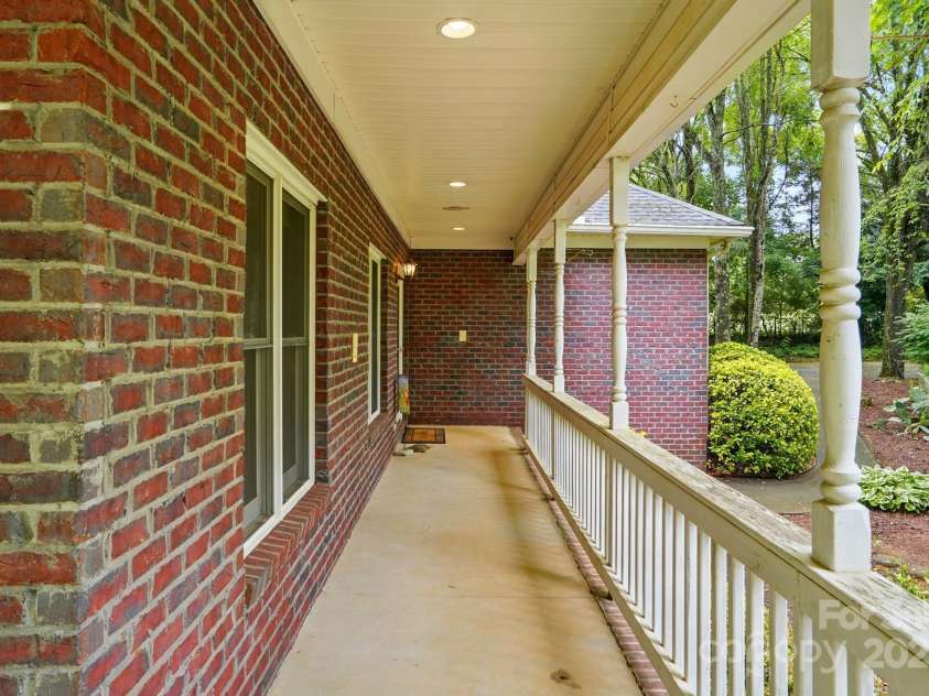 7725 Whitmire Lane, Mint Hill, NC 28227.  MLS# CAR4265038, YatesRealty ID 16623. Rocking Chair Front Porch