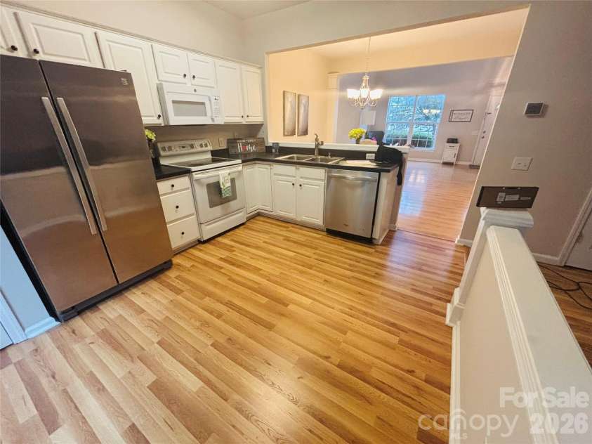 6930 Beverly Springs Drive, Charlotte, NC 28270.  MLS# CAR4363174, YatesRealty ID 16629. None professional photos but newly installed flooring.