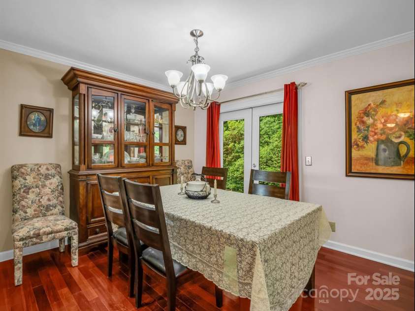 24 Middlemount Road, Pisgah Forest, NC 28768.  MLS# CAR4245556, YatesRealty ID 16634. Dining room with french door to back patio