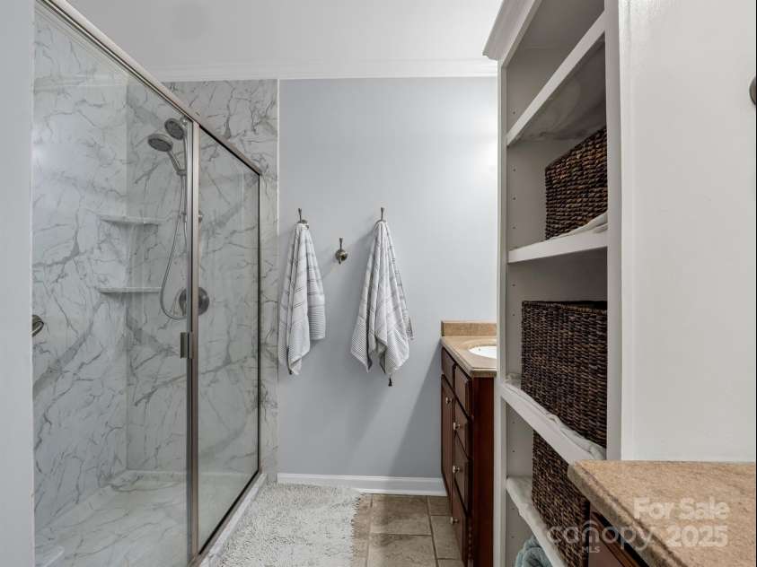 24 Middlemount Road, Pisgah Forest, NC 28768.  MLS# CAR4245556, YatesRealty ID 16634. Primary bath