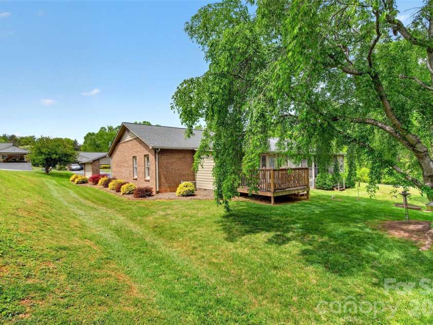 54 Deer Run Drive, Marion, NC 28752.  MLS# CAR4366901, YatesRealty ID 16636. Backyard view of yard