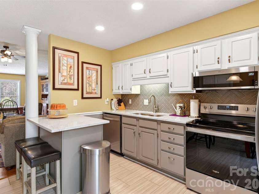 54 Deer Run Drive, Marion, NC 28752.  MLS# CAR4366901, YatesRealty ID 16636. Kitchen has updated painted cabinets
