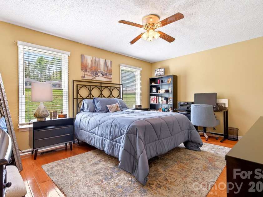 54 Deer Run Drive, Marion, NC 28752.  MLS# CAR4366901, YatesRealty ID 16636. Open and bright primary bedroom