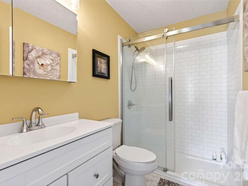 54 Deer Run Drive, Marion, NC 28752.  MLS# CAR4366901, YatesRealty ID 16636. Primary Bath has a great walk in shower