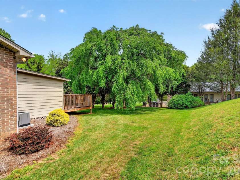 54 Deer Run Drive, Marion, NC 28752.  MLS# CAR4366901, YatesRealty ID 16636. Side yard of townhome yard