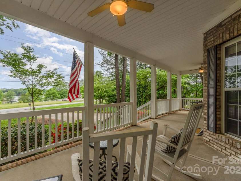 7525 Windy Pine Circle, Denver, NC 28037.  MLS# CAR4250896, YatesRealty ID 16636. Rocking chair front porch