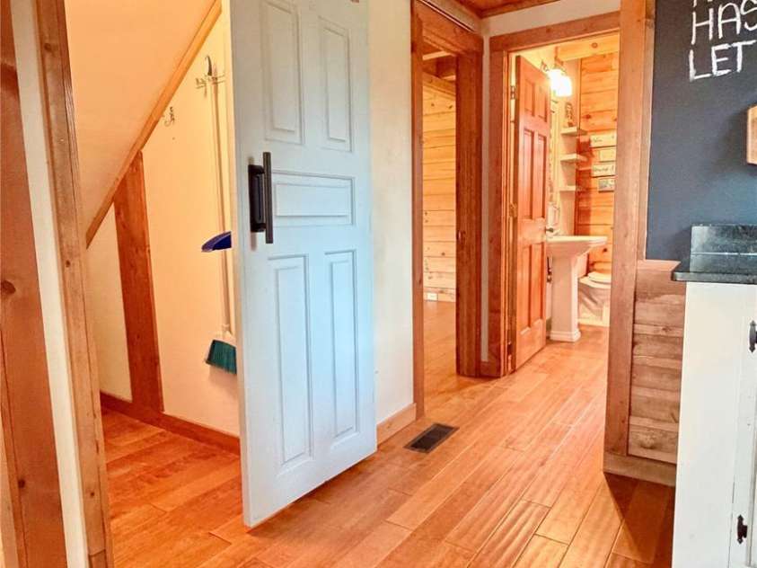 1142 Clearwater Parkway, Rutherfordton, NC 28139.  MLS# CAR4366503, YatesRealty ID 16637. Main level hallway with storage closet