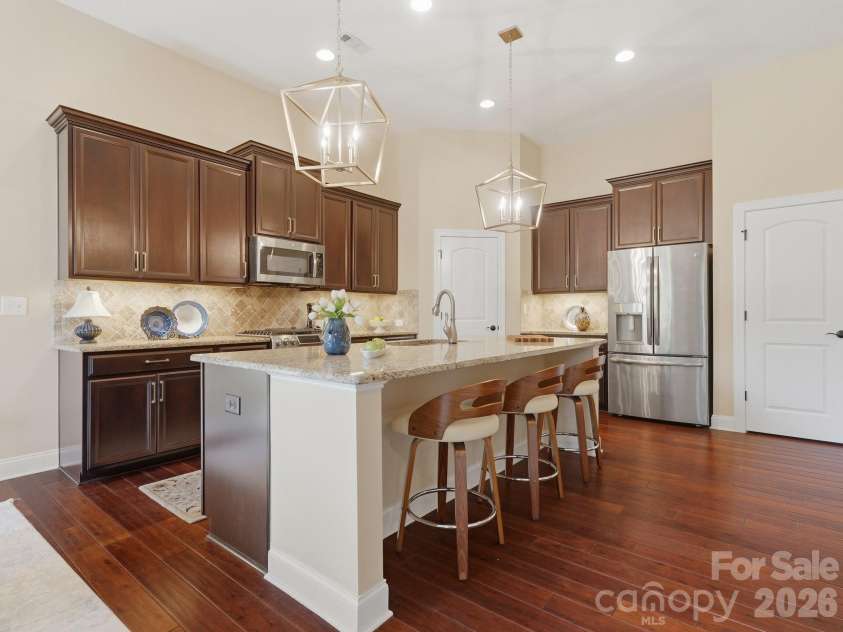 431 Trillium Way, Belmont, NC 28012.  MLS# CAR4372029, YatesRealty ID 16641. Large kitchen island with stylish updated lighting and seating for 3-4