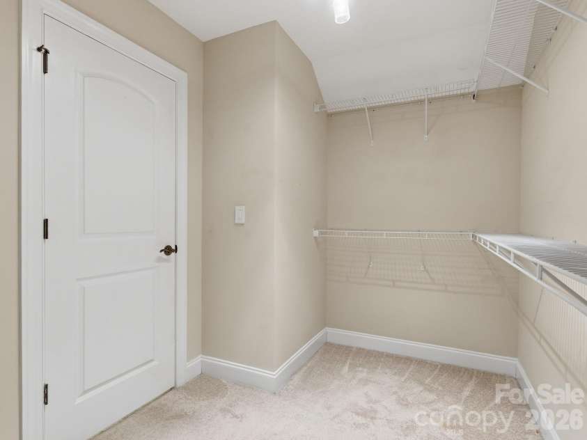 431 Trillium Way, Belmont, NC 28012.  MLS# CAR4372029, YatesRealty ID 16641. Large primary closet with motion-sensor lighting