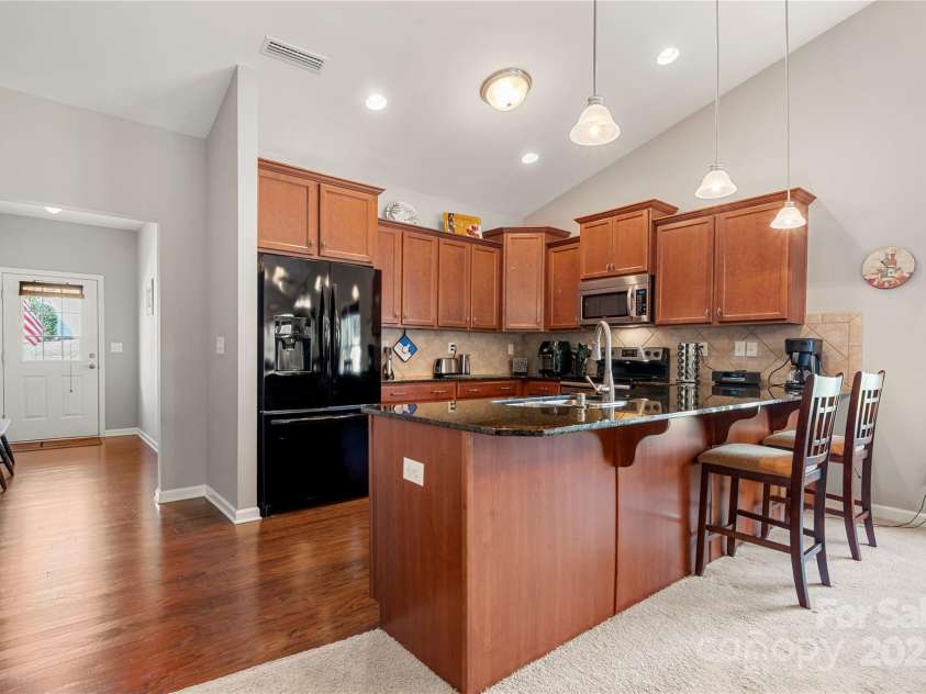 25566 Seagull Drive, Lancaster, SC 29720.  MLS# CAR4266015, YatesRealty ID 16645. Huge Kitchen with eat at bar and ample cabinetry