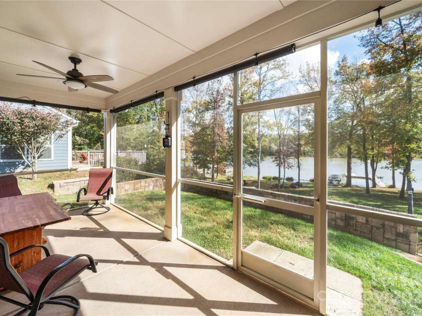 25566 Seagull Drive, Lancaster, SC 29720.  MLS# CAR4266015, YatesRealty ID 16645. Screen porch overlooking the dock just across from the golf course