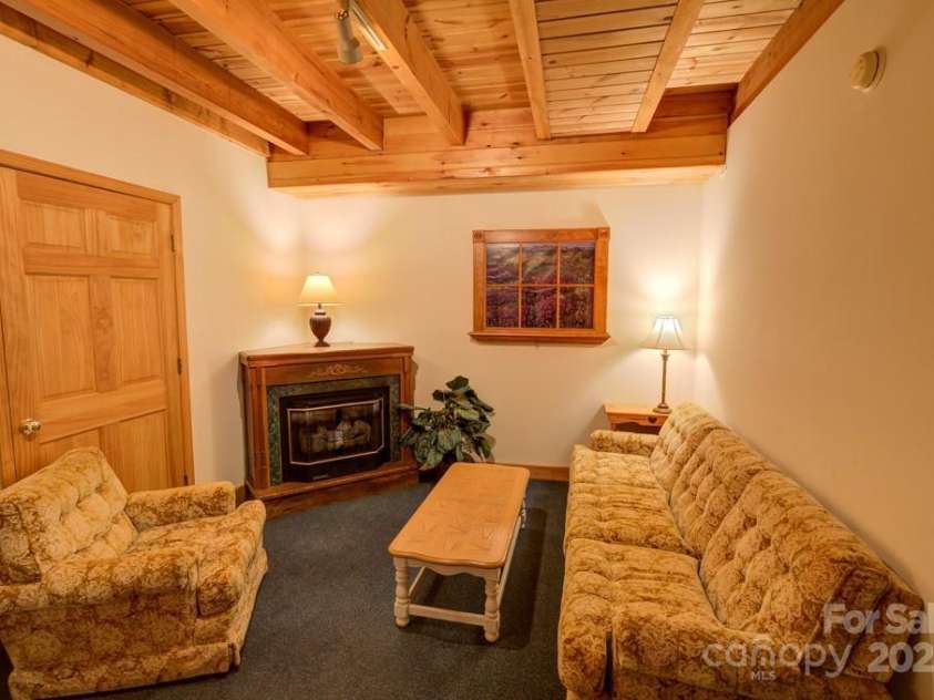 8020 Meadow Fork Road, Hot Springs, NC 28743.  MLS# CAR4306581, YatesRealty ID 16652. Lower level sitting area in Main Lodge