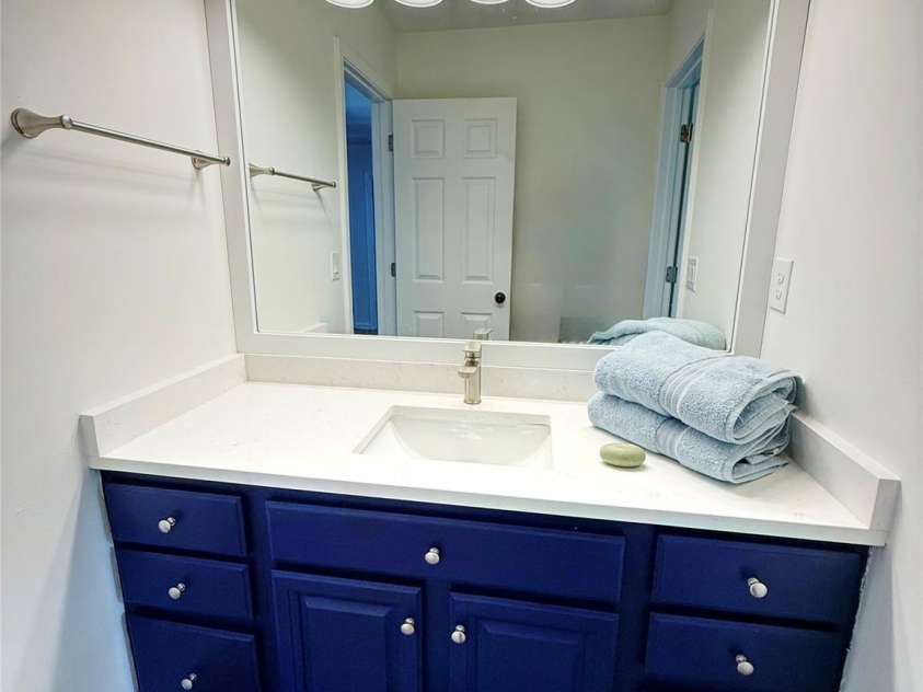 3919 Cherrybrook Drive, Mint Hill, NC 28227.  MLS# CAR4361904, YatesRealty ID 16653. Sharp blue vanity with quartz countertop