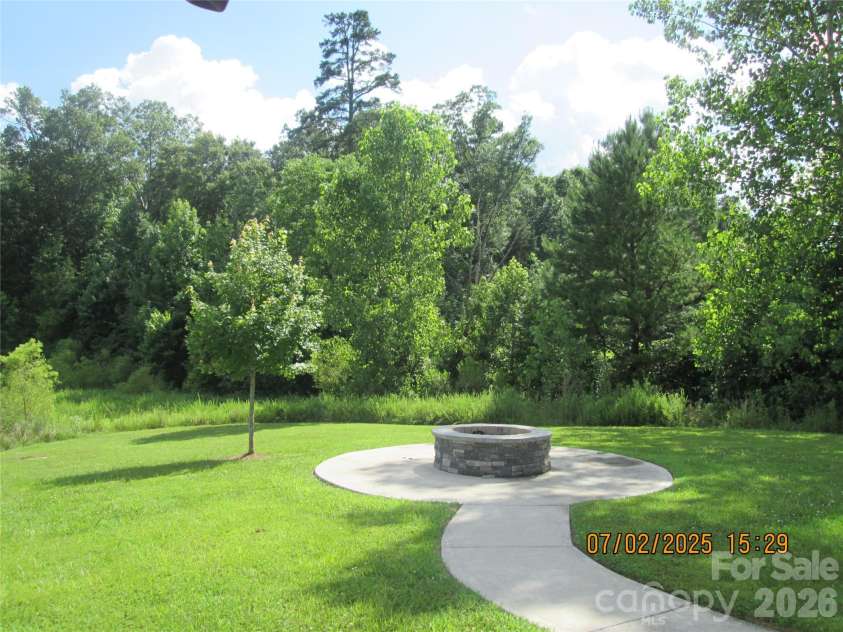 504 Stone River Parkway, Mount Holly, NC 28120.  MLS# CAR4280796, YatesRealty ID 16663. Fire pit
