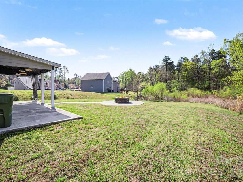 504 Stone River Parkway, Mount Holly, NC 28120.  MLS# CAR4280796, YatesRealty ID 16663. Spacious backyard close to pool