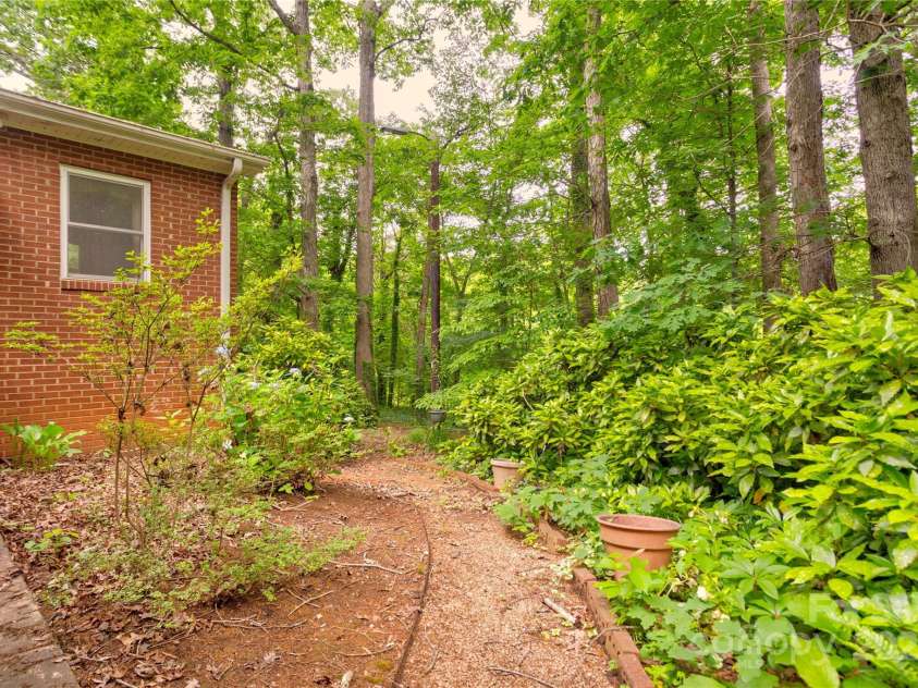 235 John Rainey Road, Salisbury, NC 28147.  MLS# CAR4241333, YatesRealty ID 16665. Beautiful foliage leading to back of home