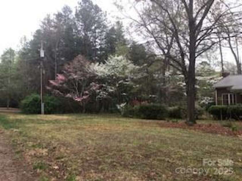 235 John Rainey Road, Salisbury, NC 28147.  MLS# CAR4241333, YatesRealty ID 16665. View of side yard
