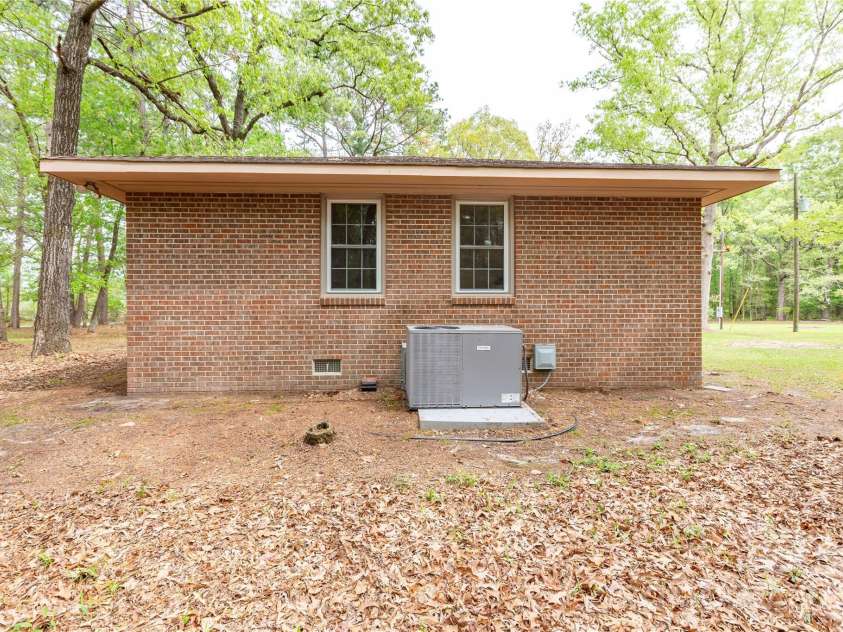 1224 Loop Road, Hookerton, NC 28538.  MLS# CAR4359217, YatesRealty ID 16669. End of house with HVAC