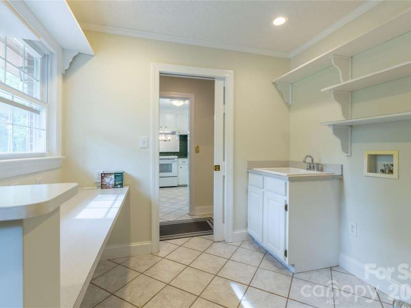 1224 Loop Road, Hookerton, NC 28538.  MLS# CAR4359217, YatesRealty ID 16669. Laundry Rm, Desk or folding table, half bath