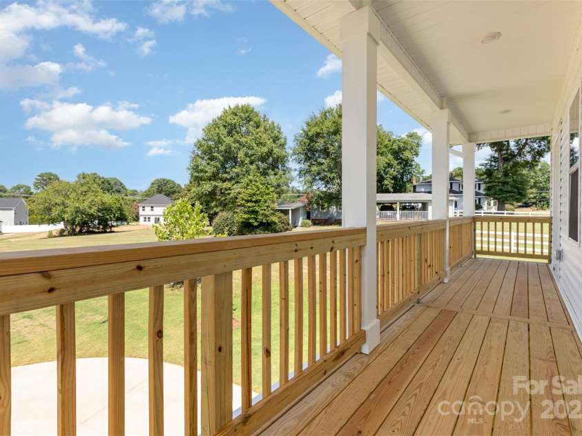 2063 Sadler Woods Lane, Charlotte, NC 28214.  MLS# CAR4275190, YatesRealty ID 1667. Front balcony that stretches width of home. Representational Photo