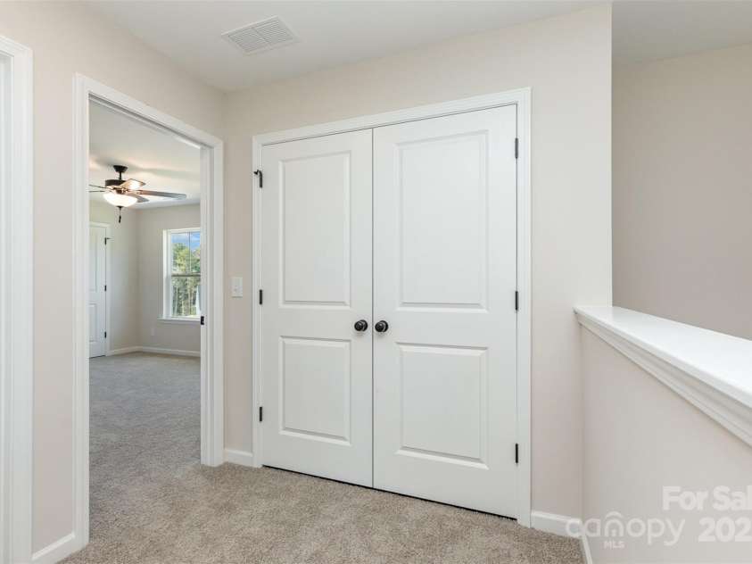 2063 Sadler Woods Lane, Charlotte, NC 28214.  MLS# CAR4275190, YatesRealty ID 1667. Laundry nook off primary suite. Representational Photo