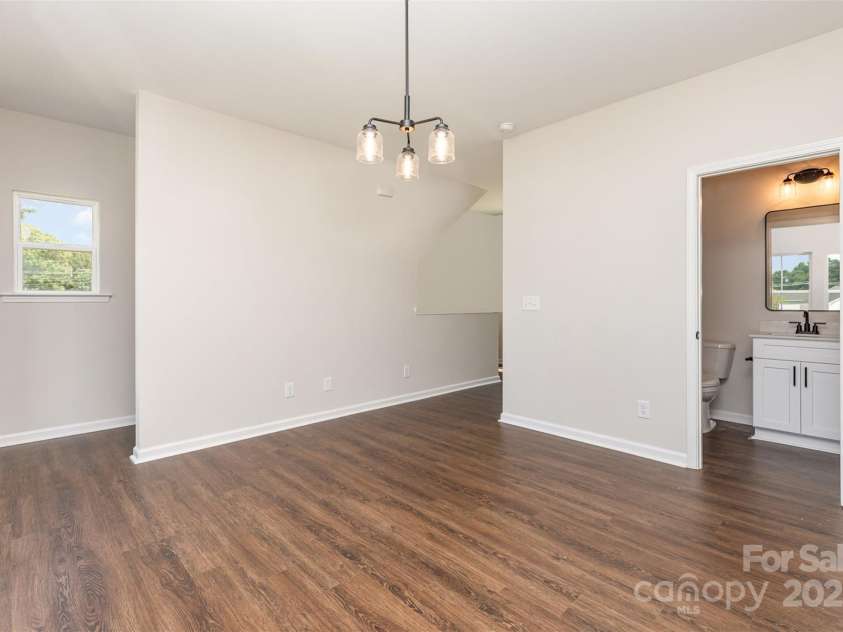 2063 Sadler Woods Lane, Charlotte, NC 28214.  MLS# CAR4275190, YatesRealty ID 1667. SPC flooring throughout main floor. Representational Photo