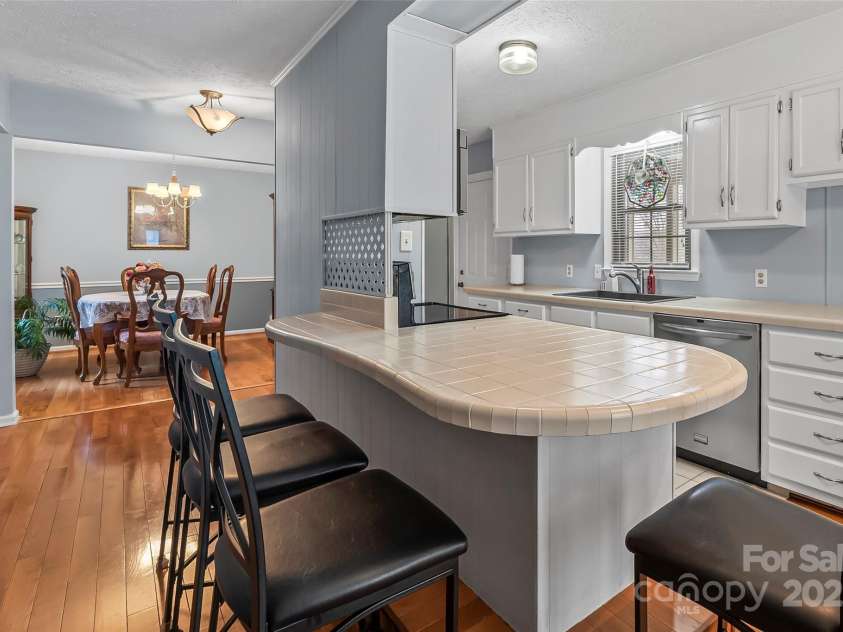 3829 Norman Road, Morganton, NC 28655.  MLS# CAR4238745, YatesRealty ID 16673. Breakfast bar next to fireplace