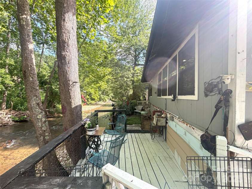 101 Mallard Loop, Waynesville, NC 28785.  MLS# CAR4257285, YatesRealty ID 16684. From this deck you will enjoy the nature and sound of the river and nature.