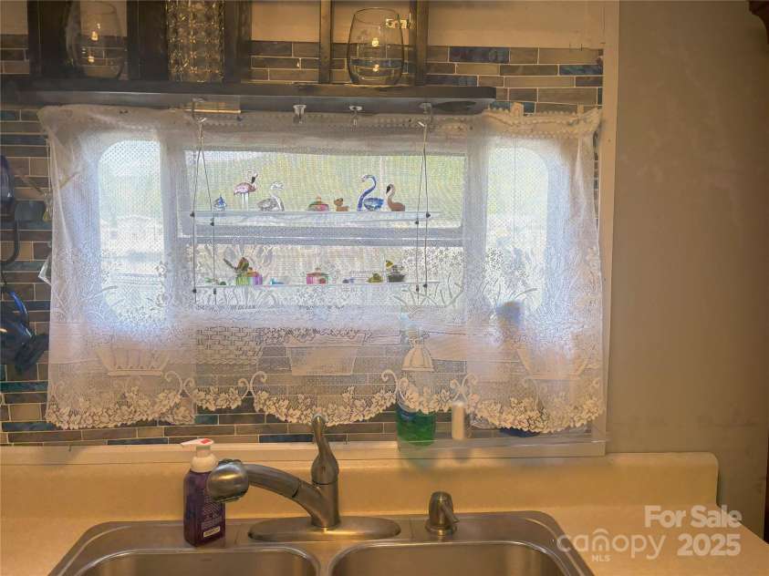 101 Mallard Loop, Waynesville, NC 28785.  MLS# CAR4257285, YatesRealty ID 16684. You can look at the lake from the kitchenette.