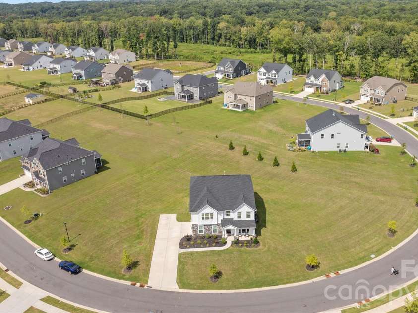 1308 Ashe Meadow Drive, Indian Trail, NC 28079.  MLS# CAR4361531, YatesRealty ID 16685. AERIAL VIEW OF HOME SHOWS ITS LARGE SIZE AND DISTANCE FROM NEIGHBORING HOMES. THIS IS A 0.81 ACRE PIE SHAPED LOT WITH INFINITE POSSIBILITIES 