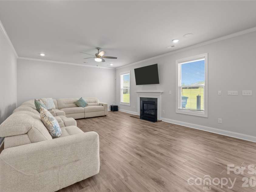 1308 Ashe Meadow Drive, Indian Trail, NC 28079.  MLS# CAR4361531, YatesRealty ID 16685. FAMILY ROOM FEATURES A GAS FIREPLACE, CEILING FAN, RECESSED LIGHTING & SURROUND SOUND SPEAKERS
