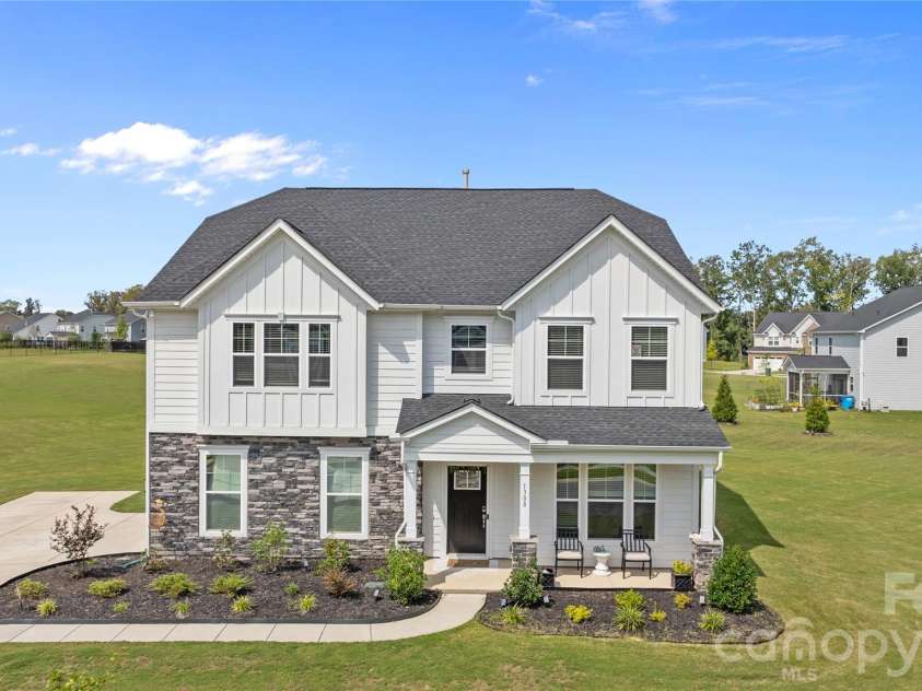 1308 Ashe Meadow Drive, Indian Trail, NC 28079.  MLS# CAR4361531, YatesRealty ID 16685. LARGE LANDSCAPED FRONT BEDS AND A COVERED FRONT PORCH TO SIT AND ENJOY