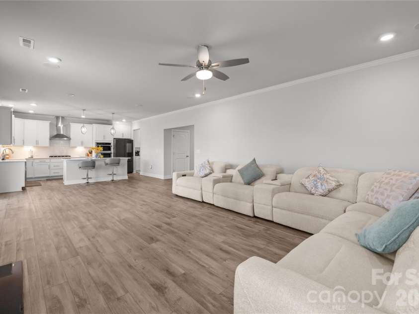 1308 Ashe Meadow Drive, Indian Trail, NC 28079.  MLS# CAR4361531, YatesRealty ID 16685. MAIN LEVEL FLOORS ARE LUXURY VINYL PLANK AS SEEN IN THE LARGE FAMILY ROOM