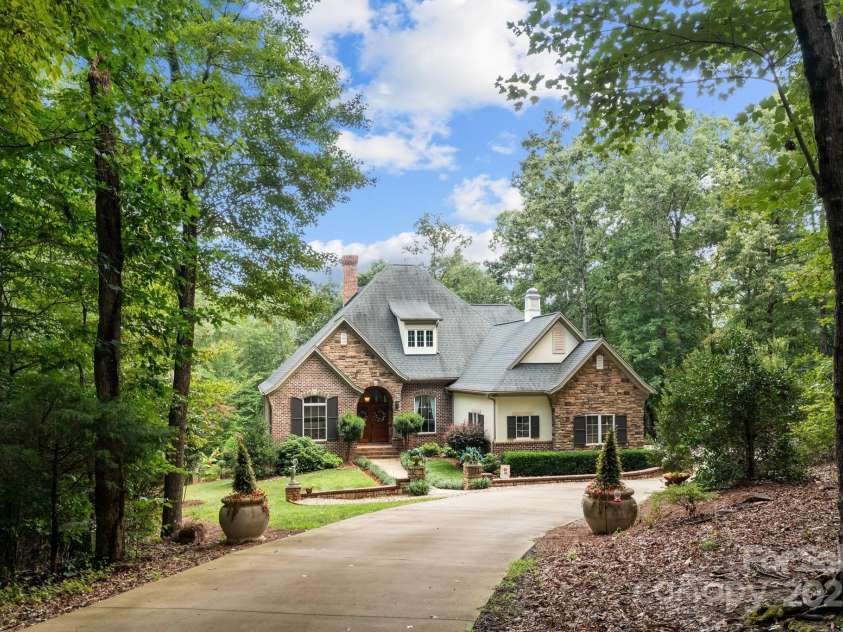 4364 Hager Mountain Lane, Iron Station, NC 28080.  MLS# CAR4172313, YatesRealty ID 16685. Aerial of entrance to the private estate