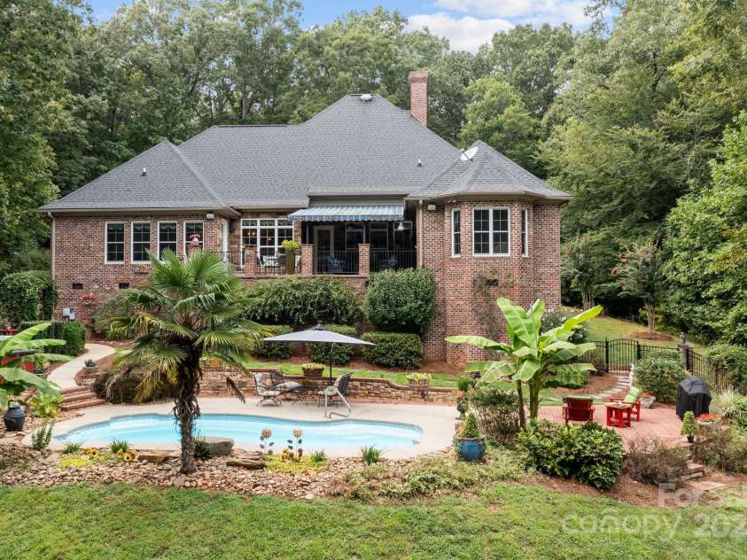 4364 Hager Mountain Lane, Iron Station, NC 28080.  MLS# CAR4172313, YatesRealty ID 16685. Pool and outdoor sitting areas